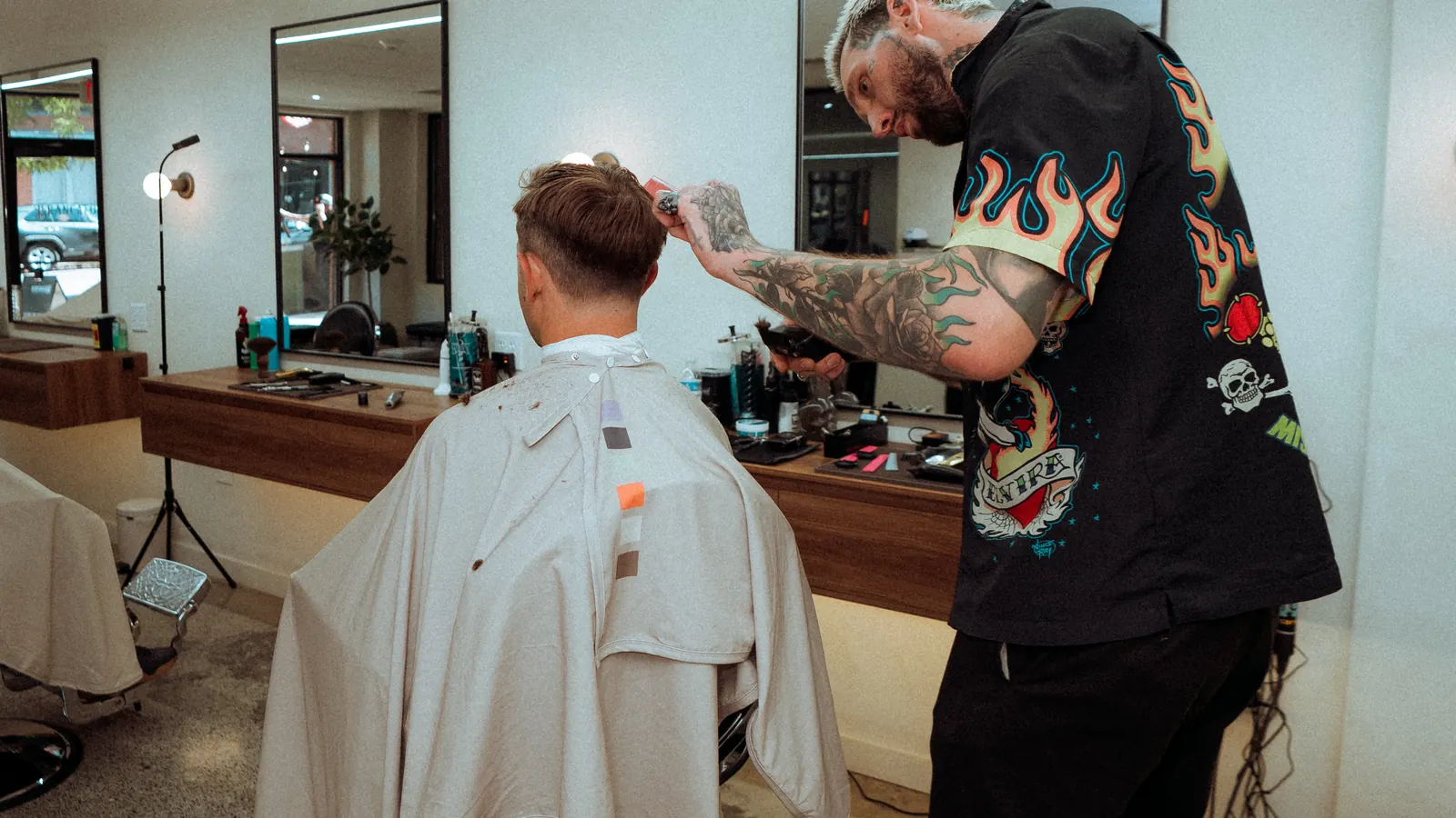 The Somerville floor: walnut counters, black mirrors and a barber mid-cut